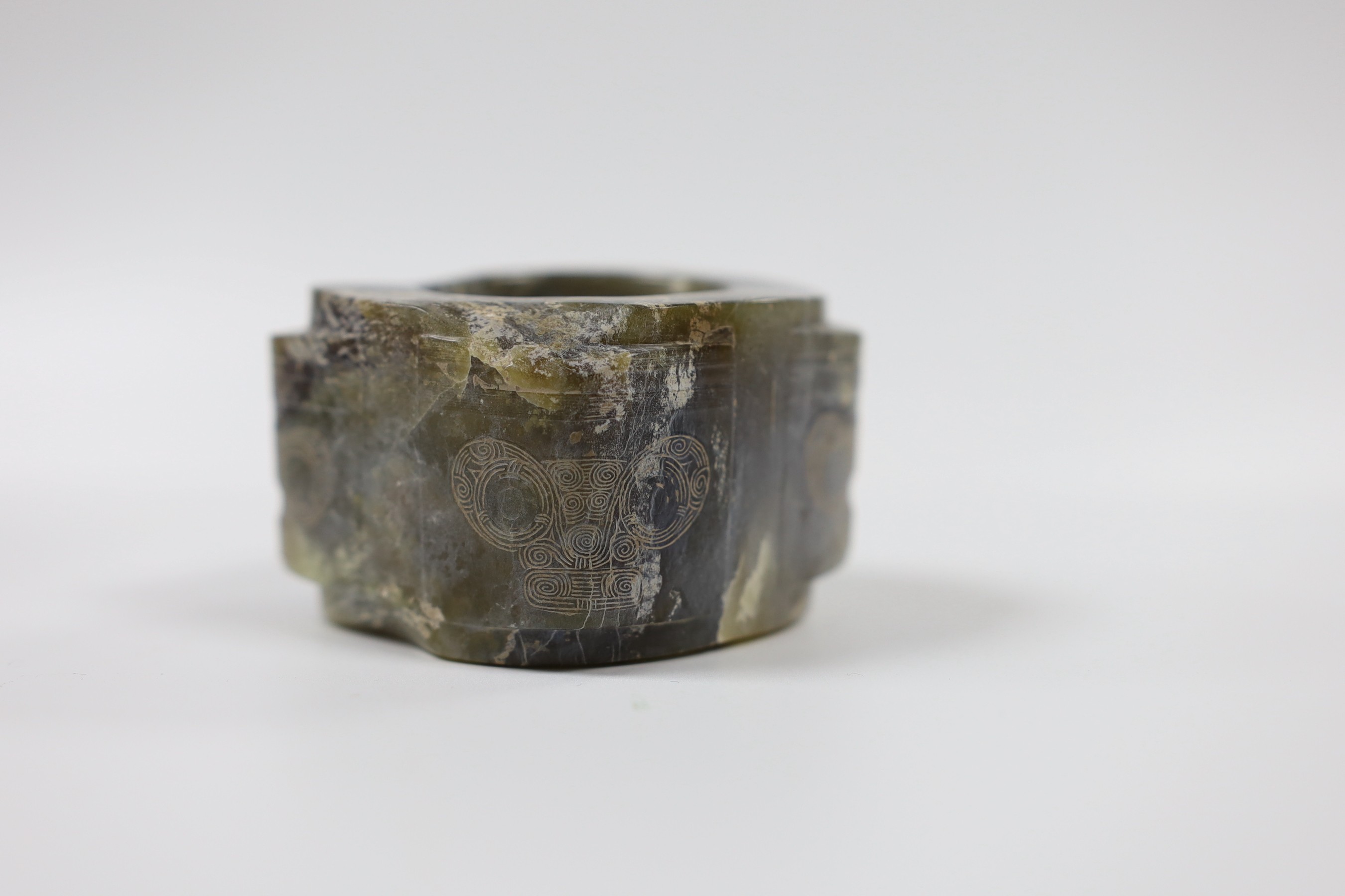 A Chinese bronze hand warmer, together with an inscribed inkstick, 16cm wide, and a hardstone carving